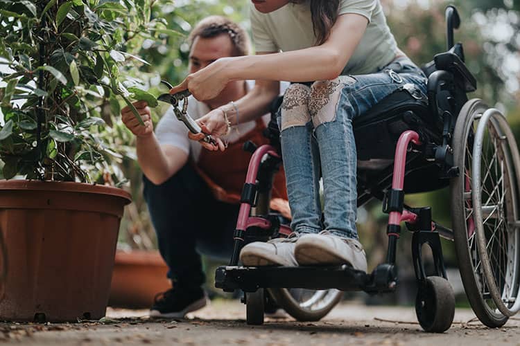 Gardening at care home with lady in wheelchair