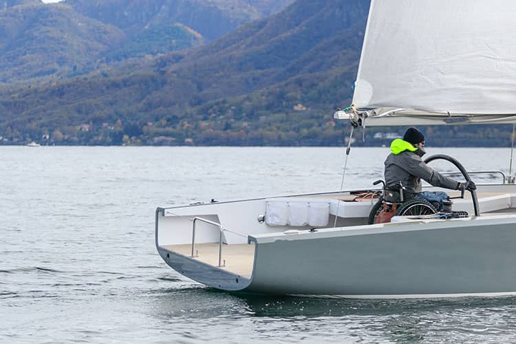 Man in wheelchair on boat in North Wales